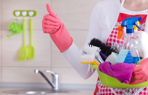 Domestic cleaner in SW5 vacuuming a bright bedroom