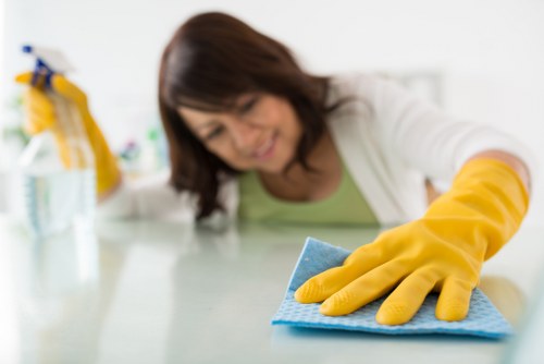 Carpet cleaning staff wearing PPE during a cleaning task